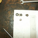 Nuts and washer outside the housing at the output terminal