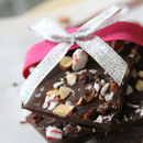 homemade dark almond bark with peppermint and cherries