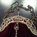 Vintage silver-plated frame with professionally renewed fabric: bordeaux velvet. Exquisite angel motif on the frame. Long chain which can be carried double. 29cm x 21cm Price: €220