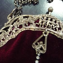 Vintage silver-plated frame with professionally renewed fabric: bordeaux velvet. Exquisite angel motif on the frame. Long chain which can be carried double. 29cm x 21cm Price: €220
