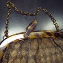 Vintage handbag. Lucite frame with lurex outer fabric, lining is synthetic. The outer fabric is tired, has some holes. Price: €65