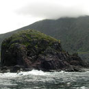 The rock of Scoglio Faraglione with Salina in the back.
