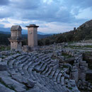 Amphitheater and tomb monuments at sunset