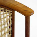 Fåtöljer design Folke Ohlsson för Bra bohag. Stomme i teak, rygg i flätad rotting och sits i tyg 'Tistel' från Jobs handtryck. H.77cm.