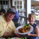 Charlie Grier age 5 of Atlanta and Cap'n Billy enjoy the days catch at Gnats Landing