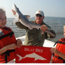 Elizabeth (7) and Patrick (5) Tilt of Smyrna, GA with one of the largest Atlantic Sharpenose sharks of the year!