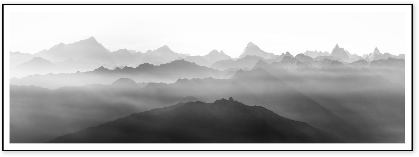 Minimal black and white panorama of alpine silhouettes including Matterhorn and Weisshorn in the eastern Valais Alps