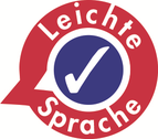 Logo vom Netzwerk Leichte Sprache - ein Kreis, außen ein roter Rand mit dem Schriftzug „leichte Sprache“, in der Mitte ein blauer Kreis mit weißem Haken