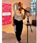 Photo of Sandra Herz as moderator in an event setting