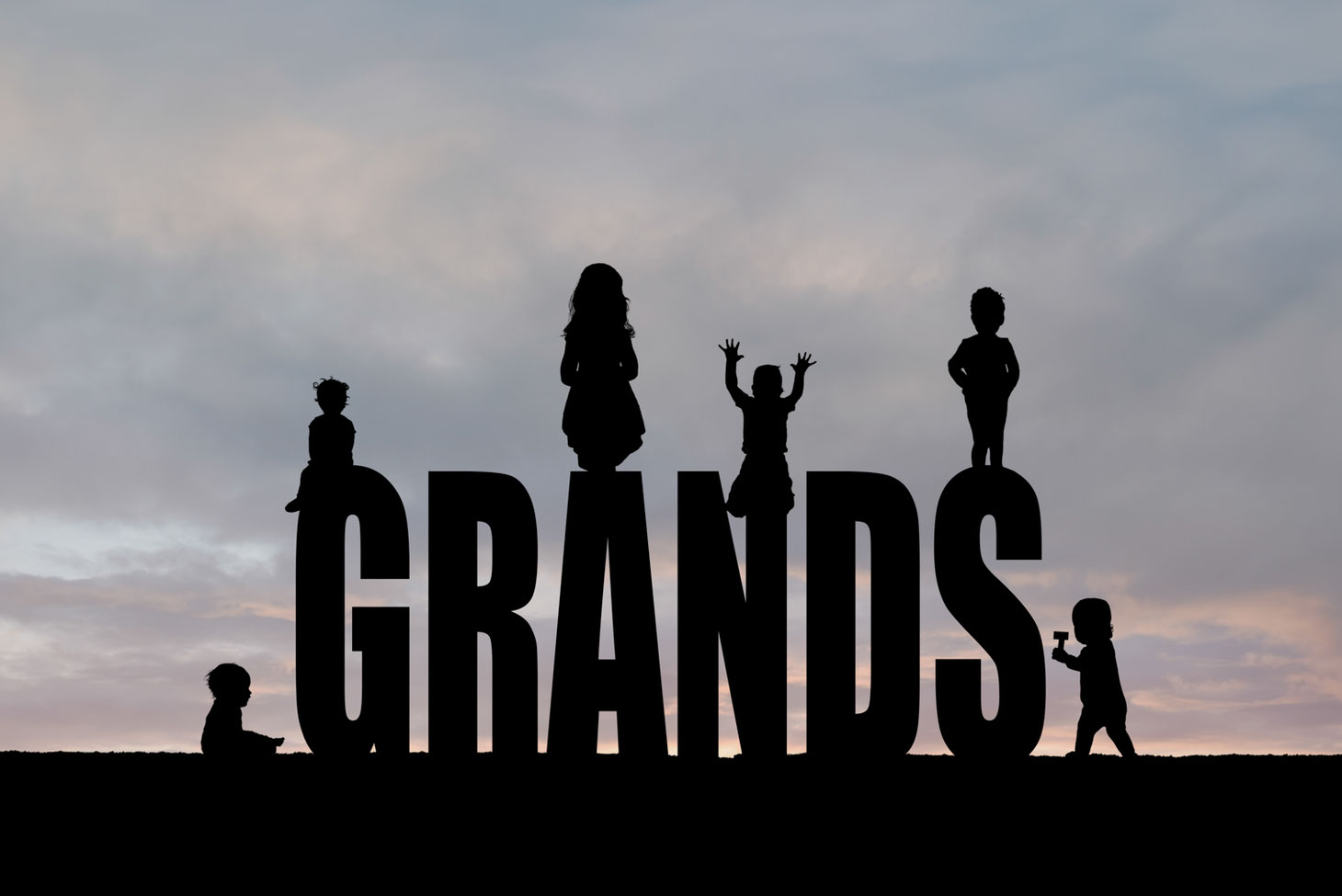 silhouettes of 6 kids on the letters GRANDS. Sky is blue, grey, and pink. 