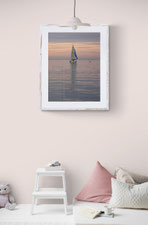 Photo of a children's room with a Delphicaphoto fine art print featuring a boat at sunset