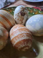 Latvian painted Easter eggs with star symbols scratched into the surface