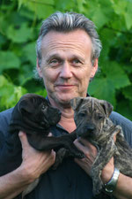 Tony with rescue puppies Moomin and George. Pic: courtesy of Sarah Fisher.