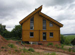 Holzhaus - Moderne Architektur aus finnischer Polarkiefer - Wohnblockhaus mit Pultdach - Blockhausbau - Ausbauhaus - Rohbauhaus - schlüsselfertig