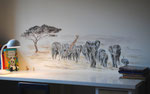 Pequeño mural infantil sobre escritorio.