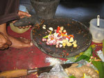 The making of a "bumbu" a flavour-paste