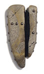 Amulet Shield No. 5 (2013) printed and painted leather over basswood, tacks, handmade paper, 7 x 3.5 x 1 inches, private collection