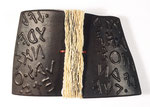 The Story of Thought (2007) kid glove leather over basswood with raised lettering, handmade paper and leather thong, 6.5 x 10 x 2 inches, private collection