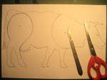 Draw moving parts onto cow and then use scissors or scalpel blade.....