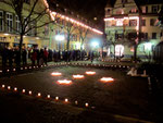 The entire downtown is iluminated with candles