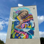 Ange au sourire de Céz'Art sur le côté de la résidence de la rue de Taissy, bien visible de l'Avenue de Champagne et de la Coulée verte réalisé en 2020 et qui remplace la publicité Abelé de 1988..               