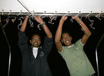 Abdu and Mohamed hanging up the christmas lights