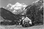 Ansichtskarte Kandersteg Kath.Kirche mit Blümlisalpgruppe (Photo Hs.Lörtscher, Frutigen)