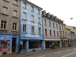 Häuserreihe an der Feldbergstrasse zwischen Klybeckstrasse und Erasmusplatz, unter anderen das Haus "Babyland-Wunderland" von Jäger und daneben das ehemalige "Nuggihuus"