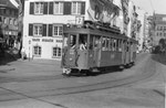 Tramzug mit Motorwagen Be 4/4 Nr.156 auf der Linie 7 in der Falknerstrasse den Barfüsserplatz anfahrend, 1970