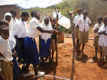 Training of how to use a tippy tap ( Kibuyu Chirizi) after installation in Ngulu Pimary School