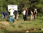 Inserting water source demarcation board in Vudee with village environmental committees