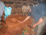 SMECAO Volunteer (Janis) and Villager (Mary) on TOT training of Mkombozi Stoves construction in Vudee Ward