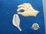Sew on the feather.