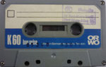 ORWO Kassette K60 dunkelgrau /Fenster schmal /  Aufkleber blau ORWO Logo weiß rechts unten / mit low noise