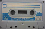 ORWO Kassette K60 grau / Fenster groß / Aufkleber blau ORWO Logo weiß links unten / mit low noise / mit nachträglichen IEC-Aufkleber unten rechts 
