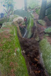 Robert drills the large boulder to make step size rocks