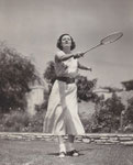1934 - playing badminton on the court of her Hollywood home