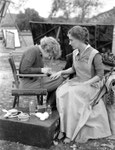 getting a manicure between scenes on the set of Stingaree