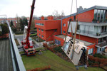 De levering van een betonnen werkblad op 4de verdieping