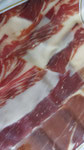 Jambon Tartessos de cebo, coupé à la main, livré sous vide. 