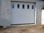 Porte de garage sectionnelle à ouverture latérale