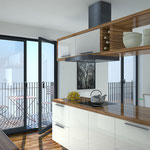 Großzügige Küche mit Balkon und fließendem Übergang zum Ess- und Wohnbereich.
