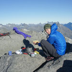 Chrissi enjoying breakfast on the Barrier Knob ridgeline, Darran Mountains.