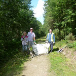 Raking cut grass from the edge of the ride at the west end of the wood.  A tidy up exercise with much chatter and laughs.