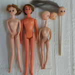 髪の毛がカットされてはげた人形、胴体が無い状態