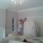 Before shot: Painter and decorator (Adam) busy at work in family home, Stansted Abbotts, Herts.