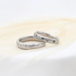 "Panda" - Eheringe Palladium 750, Damenring mit schwarzen Diamanten 2010.- / Herrenring 1490.-