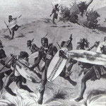 Guerrieri zulu alla carica in campo aperto.