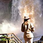 Tourist apreciating the power of the water, Iguassu Falls, Argentine 