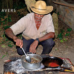 Senhor Sebastiao is 69 years old and still working as a farm employee, here cooking his dinner in an outdoor camp